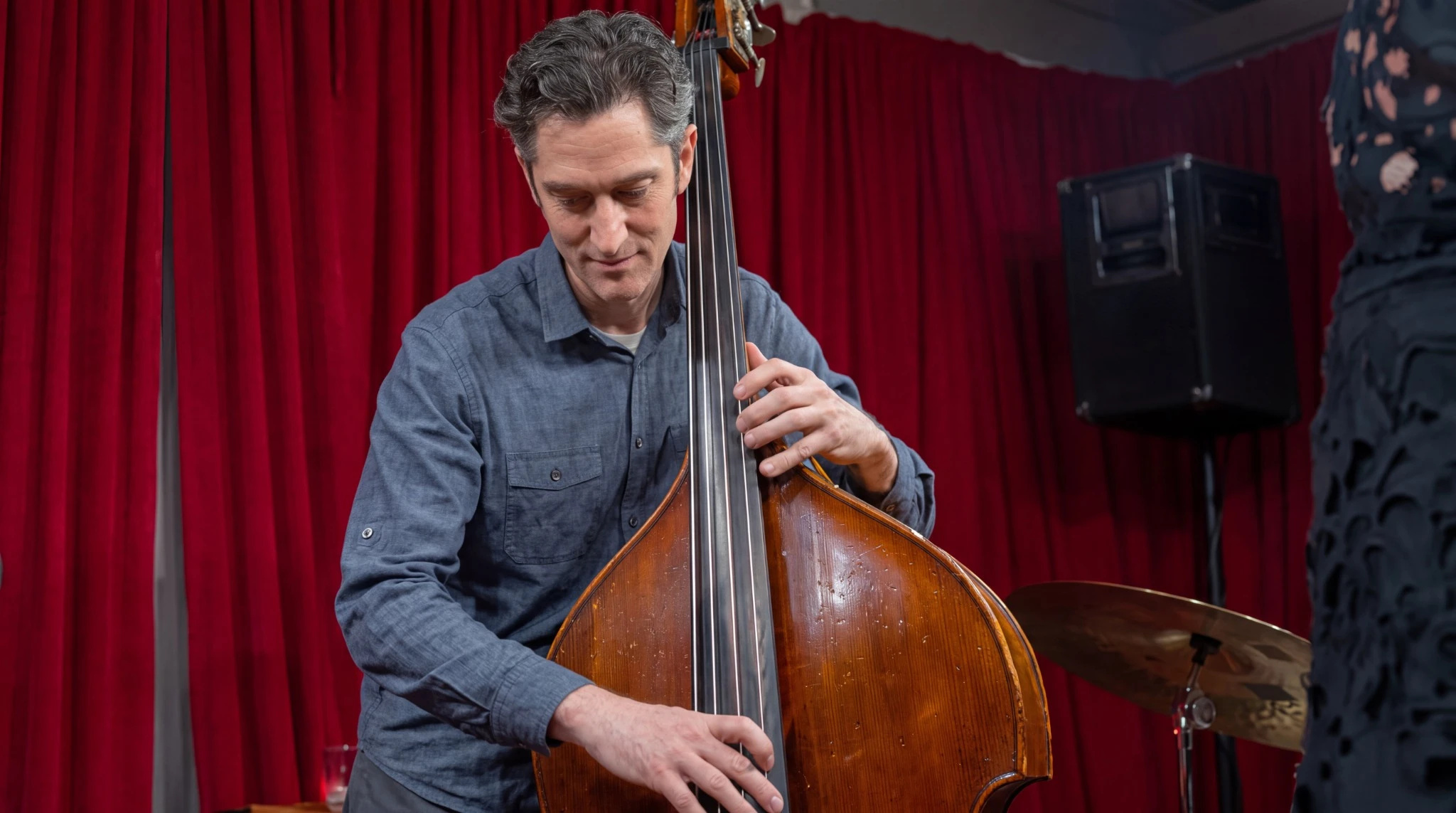 A bassist performing live on the Brvsh Cul7ur3 stage